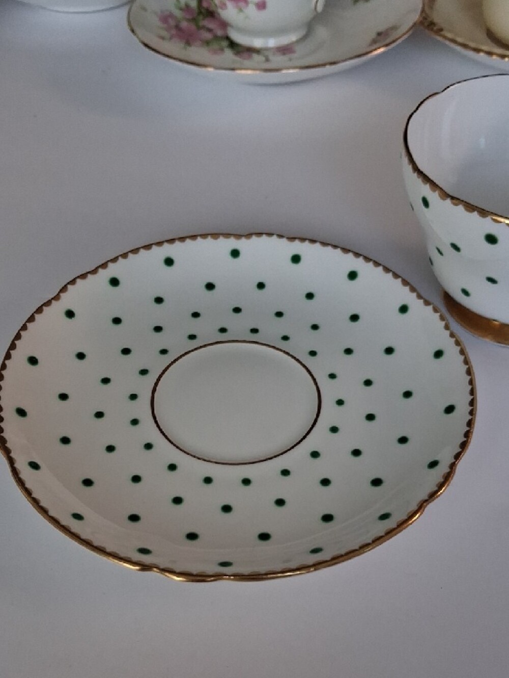 White Teacup and Saucer with Green Polka Dots and Gold Trim - Picture 2 of 4